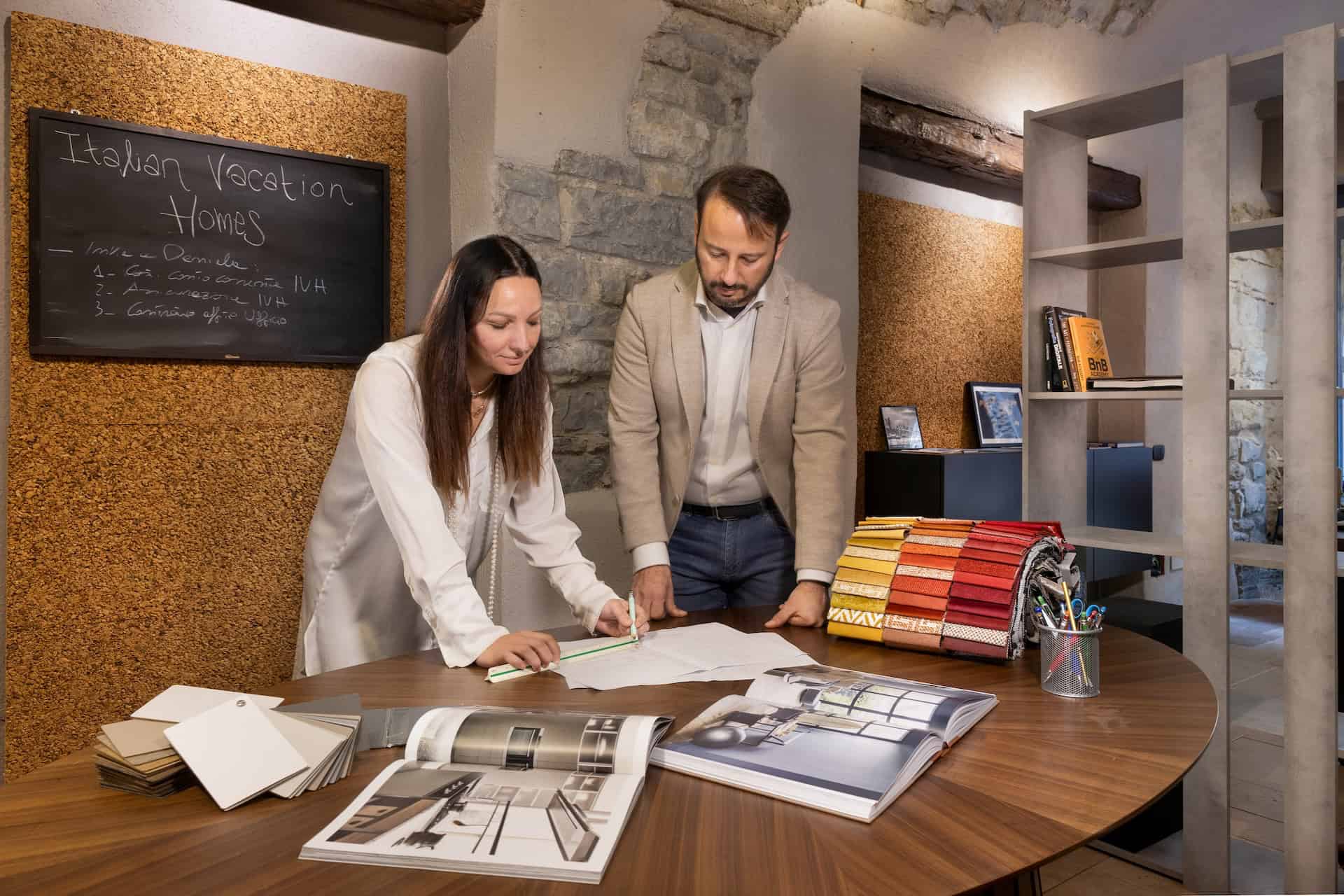 Italian Vacation Homes - men and woman working around a table